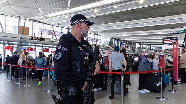 Police at Sydney Airport charged the woman over allegedly slapping a passenger and biting the flight attendant