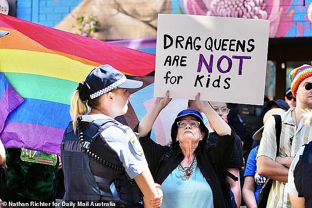 Angry demonstrators have gatecrashed a library to protest a story time event hosted by drag queen Charisma Belle