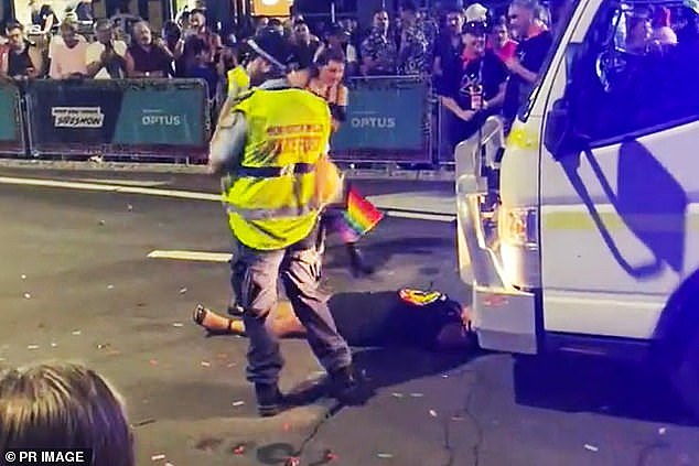 Lidia Thorpe on her first lie-down in Oxford Street, apparently mistaking a float for gay and lesbian youth charity for the federal or state police truck