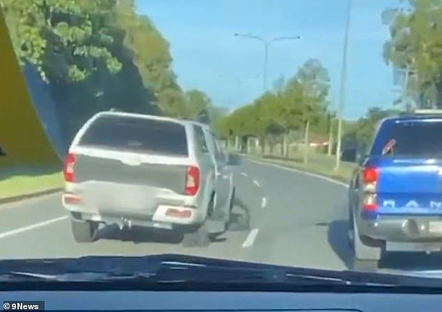 The lopsided LDV T60 Max was filmed from a vehicle behind as it chugged down a major road (pictured) in Coomera on the Gold Coast last weekend