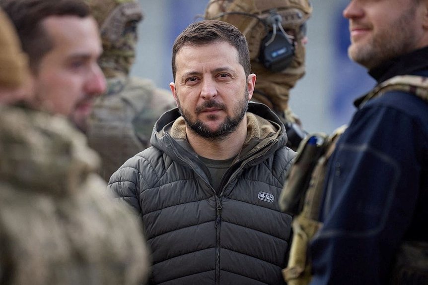 Ukraine's President Volodymyr Zelenskyy surrounded by troops.