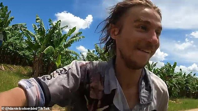 Fishing adventure influencer Daniel Colombini (pictured) has been slammed for filming himself jumping into the crocodile-infested Tully River days after a man was attacked and his dog killed