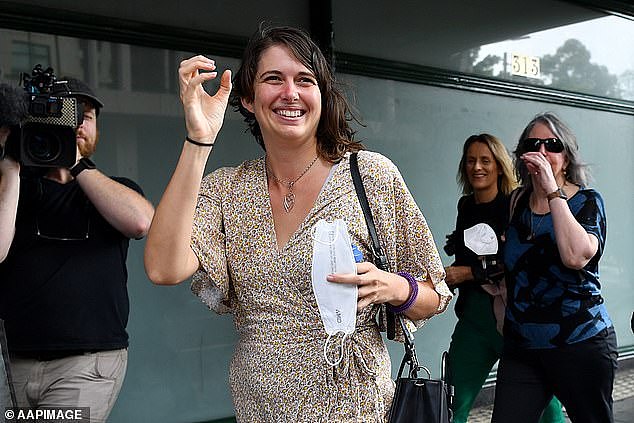 Violet Coco had her jail sentence overturned after blocking traffic on the Sydney Harbour Bridge (pictured, Ms Coco giving the 'wanker' sign as she walked out of court on Wednesday)