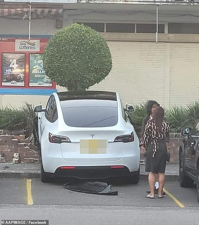 A Tesla mounted the curb and partially destroy a brick wall in a botched parking attempt over the weekend
