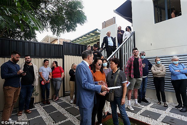 The agent said they hoped the wannabe homeowner would win some cash so 'next time you can extend your offer just that little bit more' (pictured, an auction in Sydney)