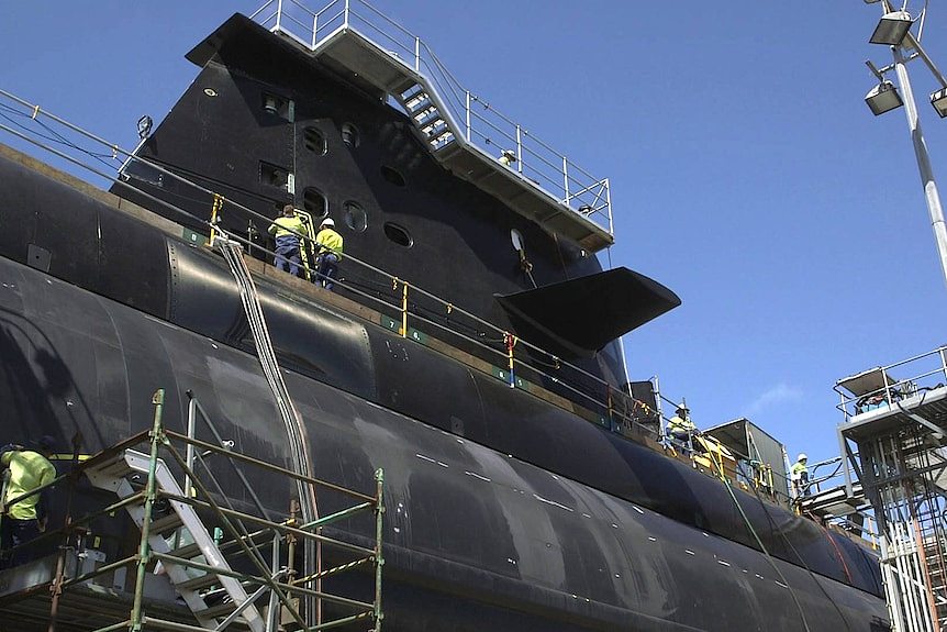 Workers on a Collins-class submarine at the ASC shipyard.