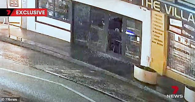 CCTV vision shows the burglar smashing in the front door of the café and stealing hundreds of dollars before fleeing the scene at around 4am. The crook remains on the run with NSW Police investigating the crime
