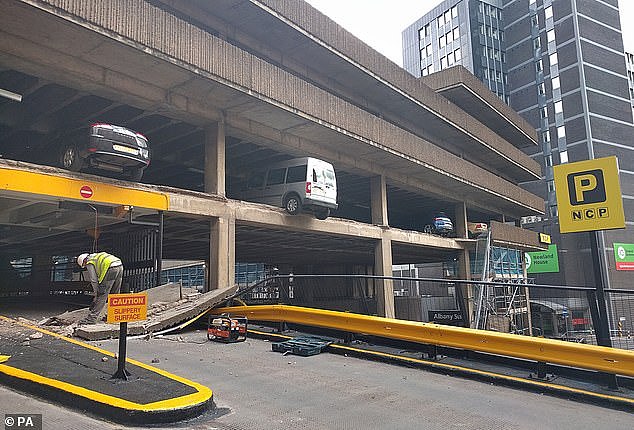 Experts warn older multi-storey car parks could be at risk of collapsing due to the weight of electric vehicles (pictured, a car park in the Britain after a wall collapsed)