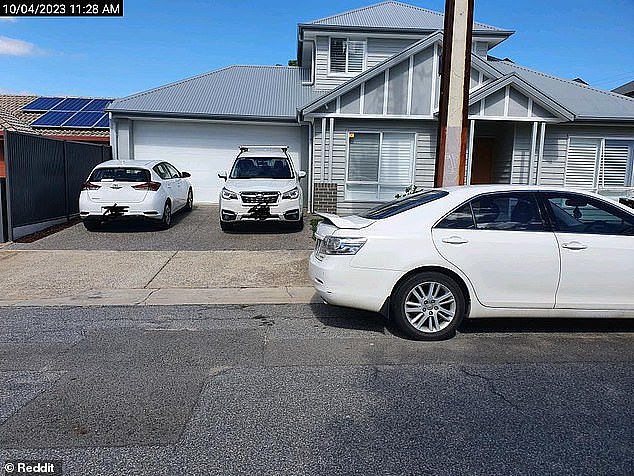 The photo, taken on April 10, shows the man's car barely encroaching on his girlfriend's driveway