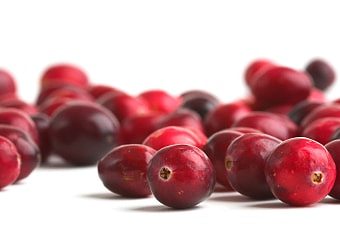 Cranberries scattered across a surface.