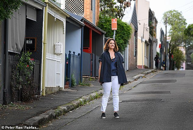 Samantha Cook (pictured in inner Sydney), who lives in the United States with her lawyer husband, bought her son a house after she saw him stressed about the rising cost of living and the rental crisis - despite not paying his own rent
