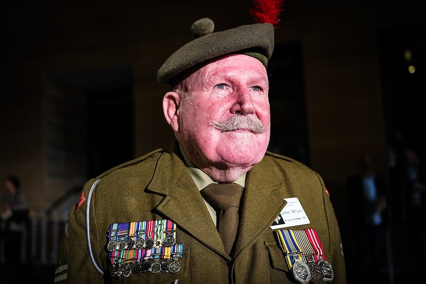 A older man in an army uniform.