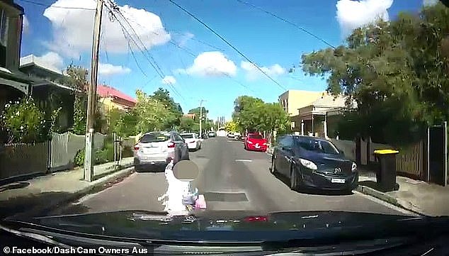 A little girl had an incredible escape after being hit by a car (pictured) and knocked over on quiet suburban street
