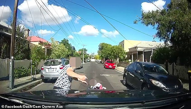 Her furious father (pictured) ran onto the road and pounded his fist on the car's bonnet and shouted at the driver before going to pick up his daughter