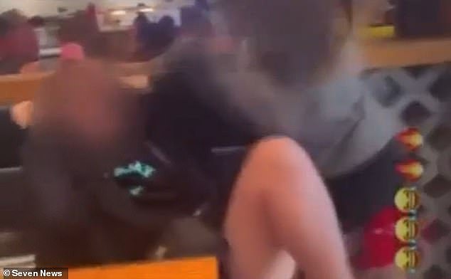 The teenager (pictured left) was sitting on her own at a table in Toowoomba's Grand Central Shopping Centre when she was allegedly set upon by three other teenage girls