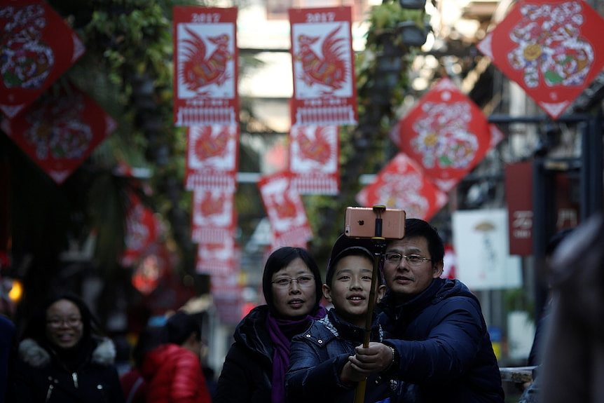 A chinese family posing in a selfie