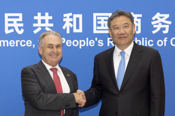 Trade Minister Don Farrell and Chinese Commerce Minister Wang Wentao in Beijing on Friday.