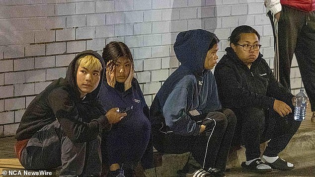 Shocked bystanders gathered with family members at Sunshine Station where a 16-year-old was stabbed