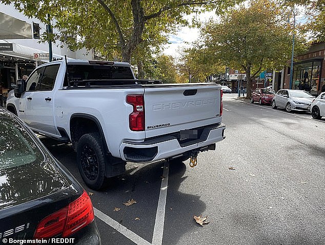 One disgruntled onlooker took to social media on Thursday posting images of a parked Chevrolet Silverado ute protruding out onto the street, blocking traffic (pictured) in Melbourne's Bayside