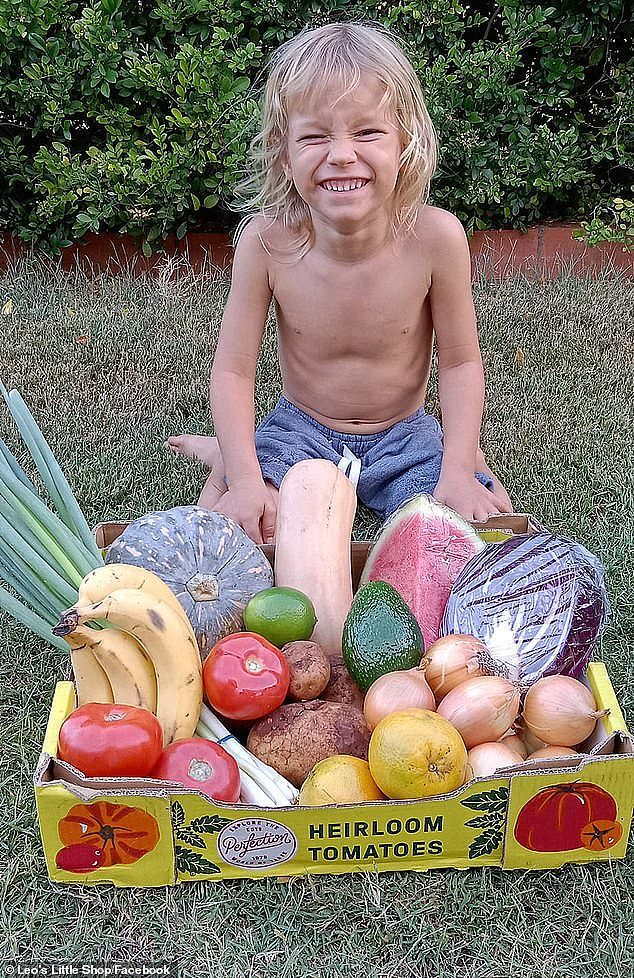 The four-year-old (pictured) buys misshapen fruit and vegetables from farmers which would otherwise be rejected by supermarkets and sells them at a discount