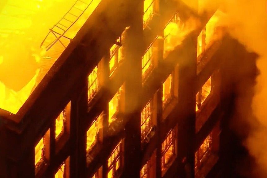 Windows of a building on fire. 
