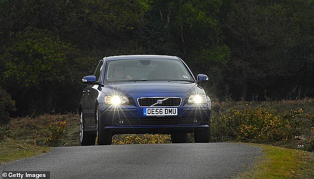 Liberal Upper House MP Nick McGowan is pushing to change road laws requiring drivers in Victoria to keep their headlights on during the day and for new imported cars to have day running light devices (stock image)