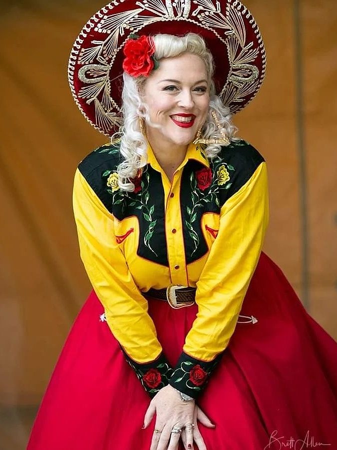 woman in big hat smiling