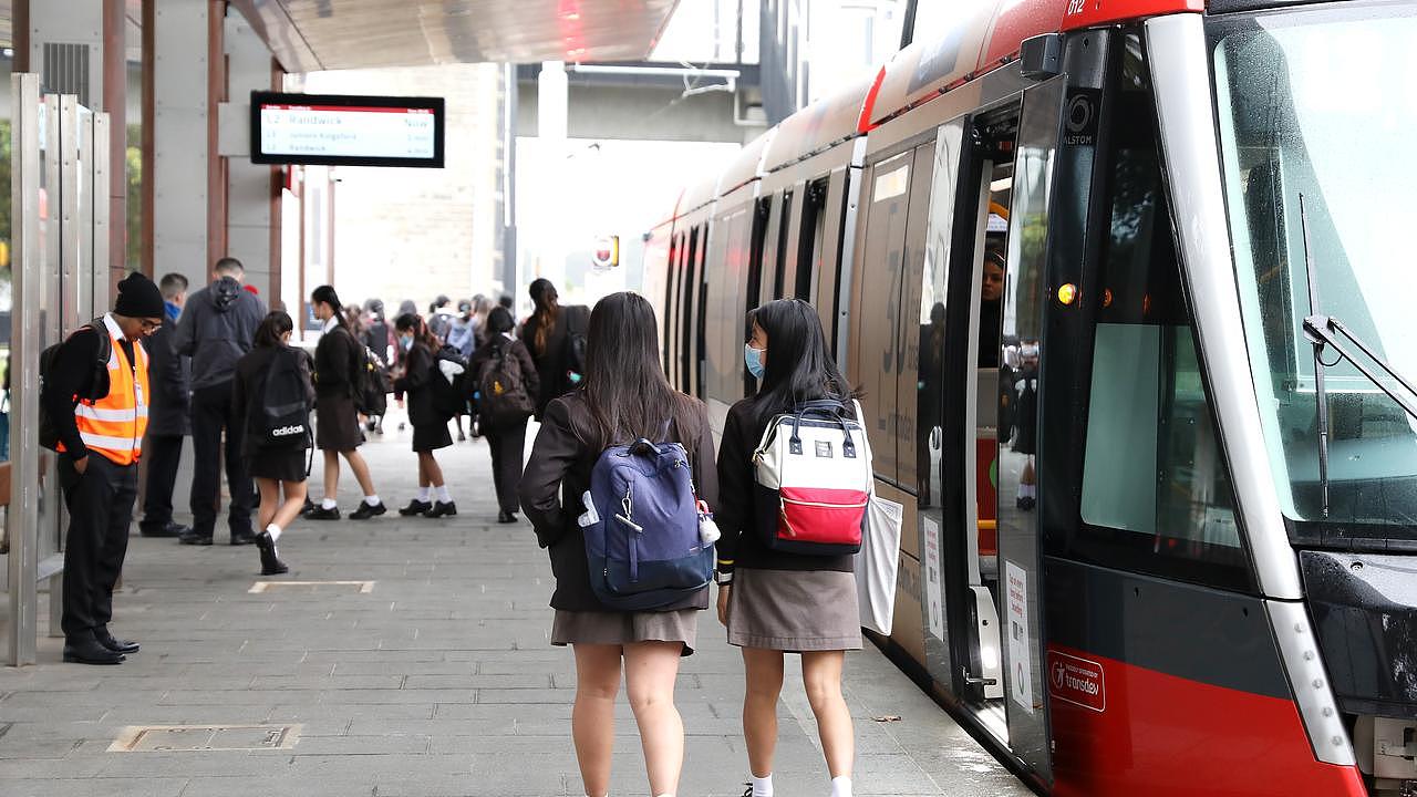 A photo of students at the light rail stop.