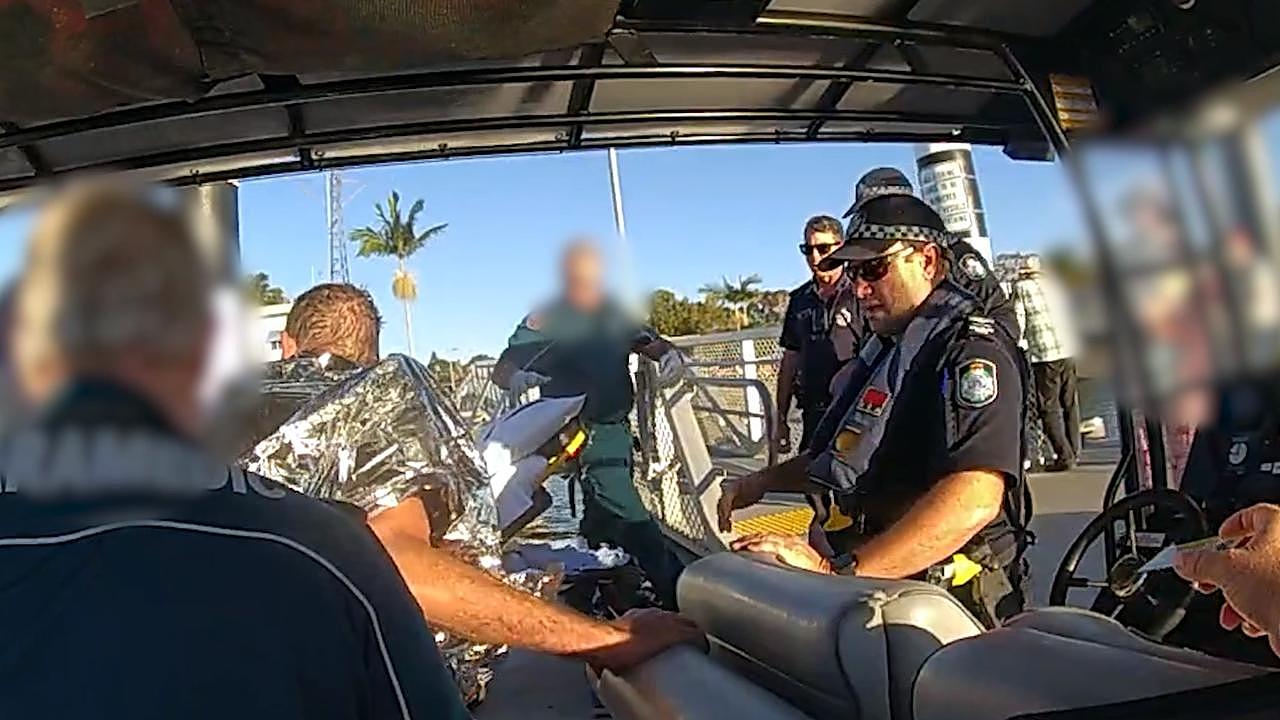 With assistance from a Queensland Boating and Fisheries Patrol officer, police managed to pull the man safely on board the police boat. Picture: Queensland Police