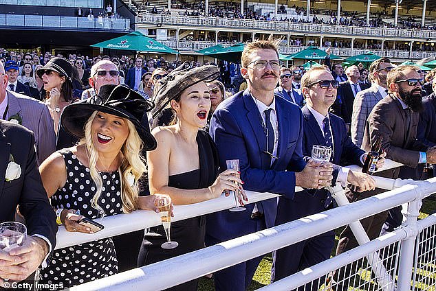Australia is the world's top destination for ultra-wealthy individuals because it doesn't have inheritance taxes and favours wealthy foreigners, a global investment migration consultancy Henley & Partners says (pictured are spectators at Sydney's Royal Randwick Racecourse)