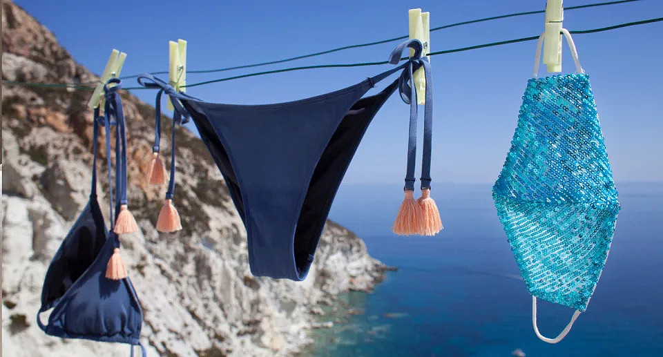 A bikini and face mask hanging on a washing line in Italy.