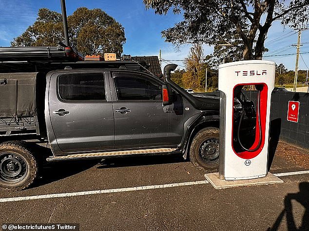 A Tesla driver lashed out on Tuesday after an sports utility vehicle was sitting in a charging spot for electric cars in Wollongong, south of Sydney (pictured)