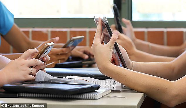 The use of mobile phones in public schools will be banned in a new policy announced by the state government (stock image pictured)