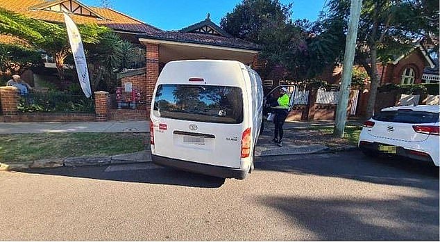 A frustrated delivery driver (pictured beside his van) who works in one of Australia's wealthiest suburbs has vented his frustration at the costly difficulties of delivering parcel there