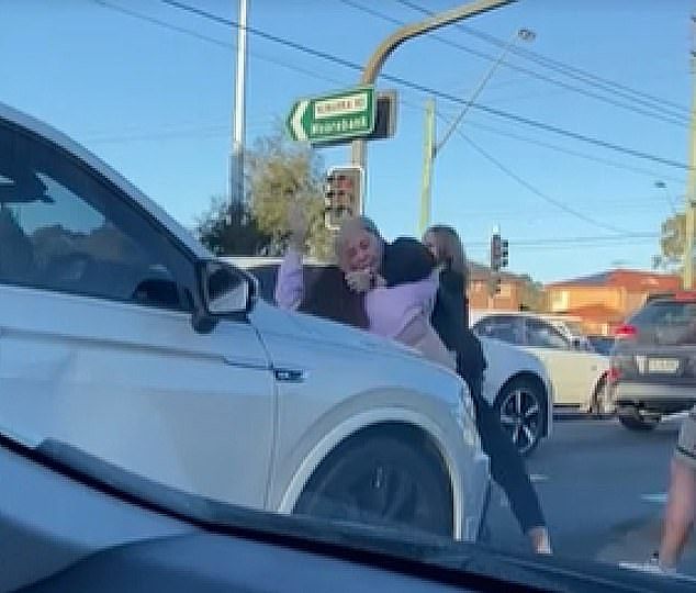 A woman in a headscarf fought against two other young women (pictured) in a road rage scuffle in Moorebank