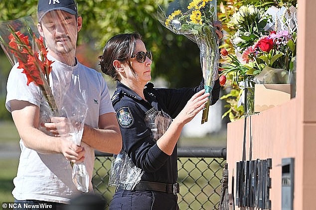 Community members have reacted to the death by placing flowers outside the police station as a tribute
