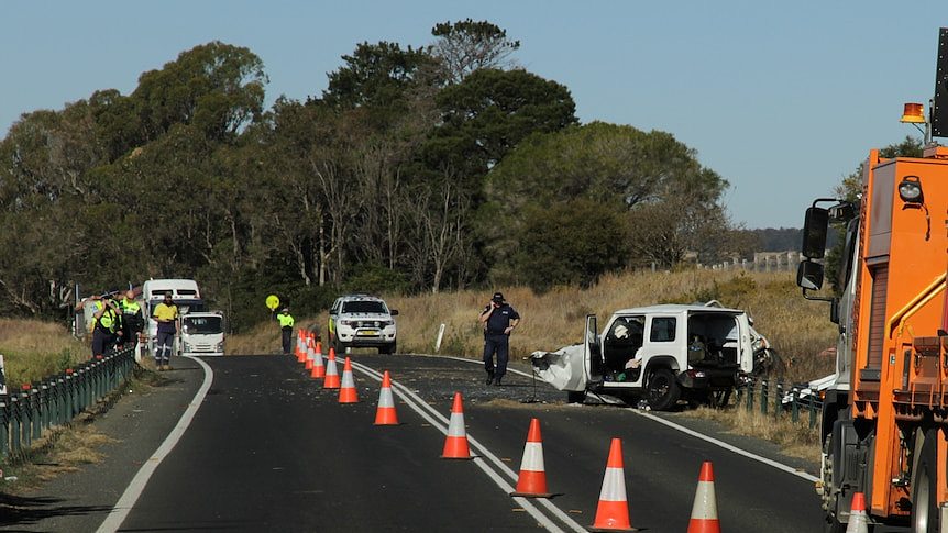 A white car crashed on the highway