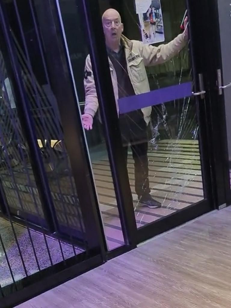 The man was filmed kicking the glass and yelling at people inside. Picture: TikTok