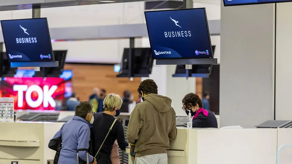 SYDNEY, AUSTRALIA - NewsWire Photos JUNE 09, 2022: Travellers and airport staff are pictured at Sydney International Airport with increased overseas travel causing chaos for DFAT in processing passport applications. Picture: NCA NewsWire / Seb Haggett
