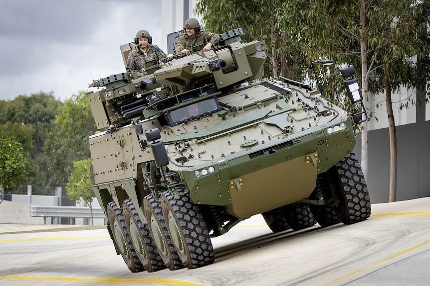 Two men in a tank. 