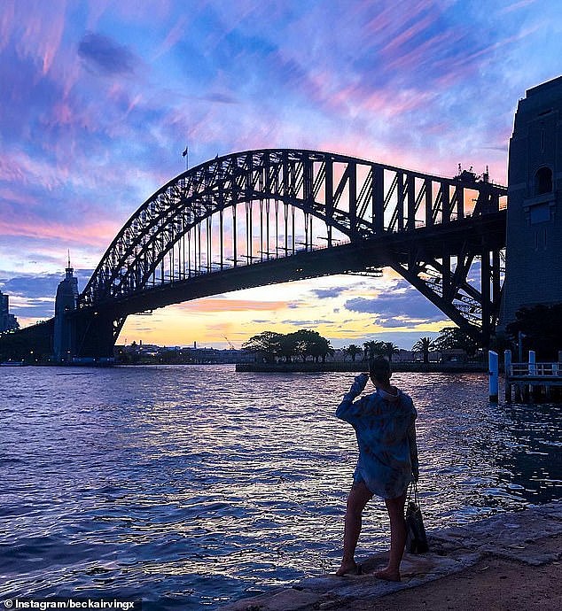 Stunning photos snapped by visitors show the bridge and city skyline contrasting with the candy floss skies