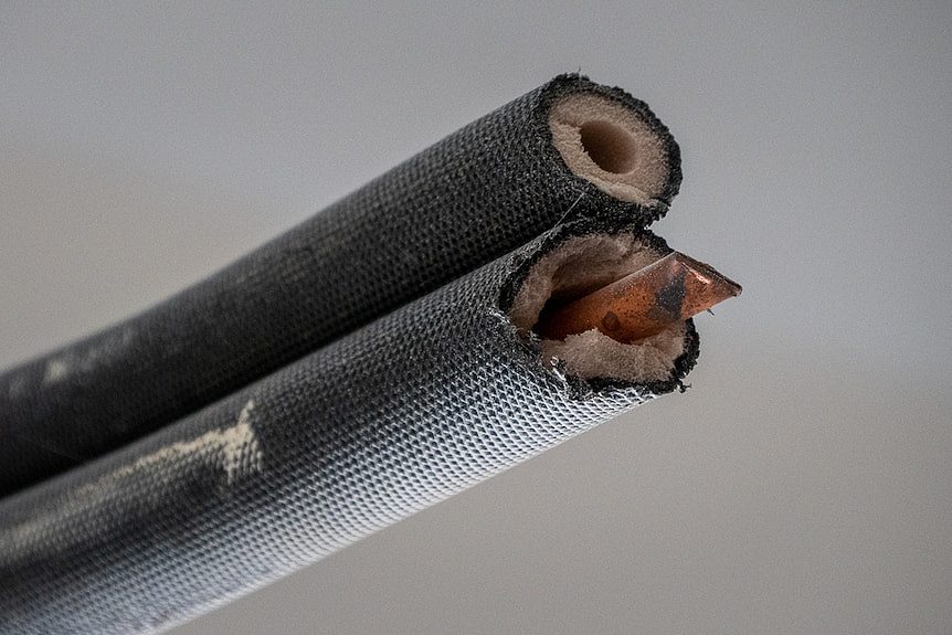 Close-up photo of copper coming out of pipe.