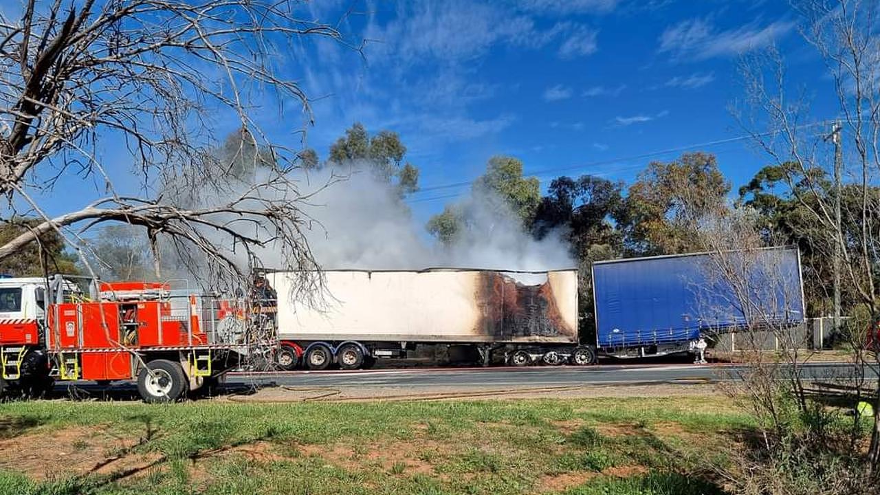 Firefighters on scene putting on the fire that started in the load being carried by a B-double truck along the Sturt Highway at Gol Gol.