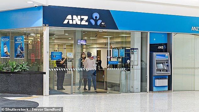 Bank workers are under the biggest threat from AI. Pictured are bank staff with customers in Sydney