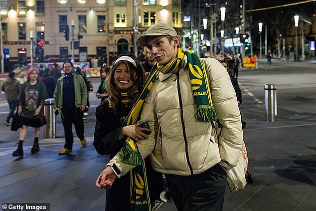 Melbourne is by far Australia's most affordable big city for renters and even prospective house or unit buyers during a cost of living crisis, a trove of data shows (pictured are Matildas fans outside Flinders Street station)