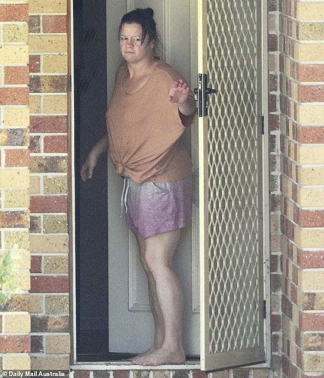 Chantelle Newbery, 46, is pictured out the front of her rental home in Brisbane in January