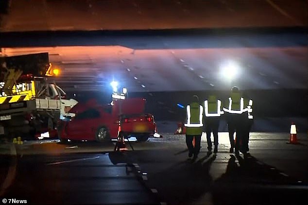 The traffic controller had parked his ute (left) on the outbound lanes of the Eastern Freeway when the accident occurred just after midnight on Wednesday morning