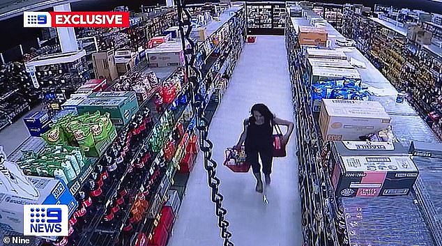 The brazen shopper was caught on CCTV dancing through the aisles and putting items into her basket before walking out of the store, allegedly without paying (pictured)