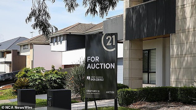 The affordability situation is grim in NSW, where a typical-income household can afford just seven per cent of the homes sold in the state (pictured, a Sydney house for auction)