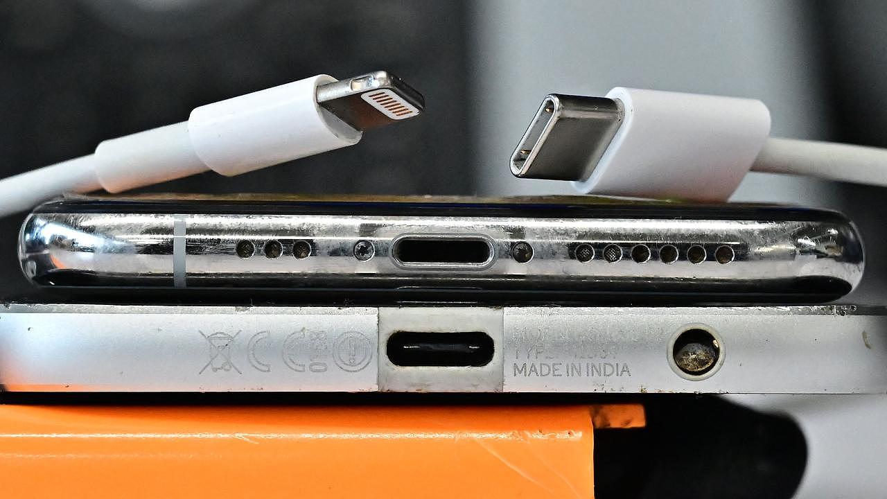 So long Lightning cable (left). Hello USB-C charger (R). (Photo by Frederic J. BROWN / AFP)